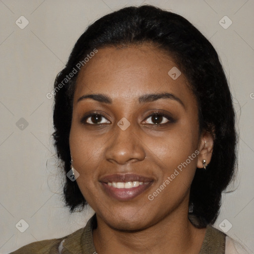 Joyful black young-adult female with medium  black hair and brown eyes