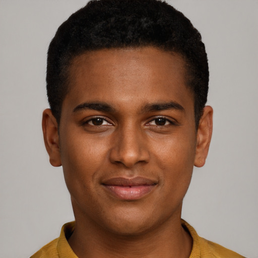 Joyful black young-adult male with short  brown hair and brown eyes