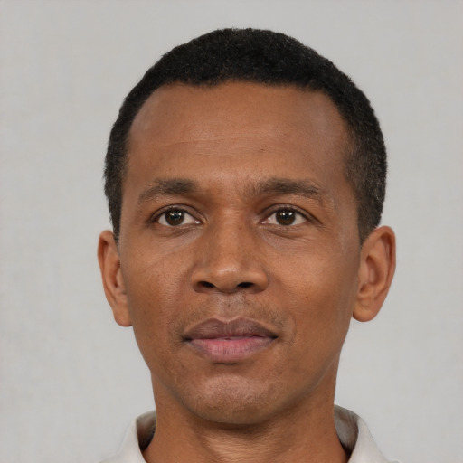 Neutral black adult male with short  brown hair and brown eyes