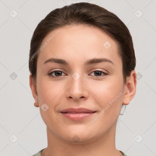 Joyful white young-adult female with short  brown hair and brown eyes