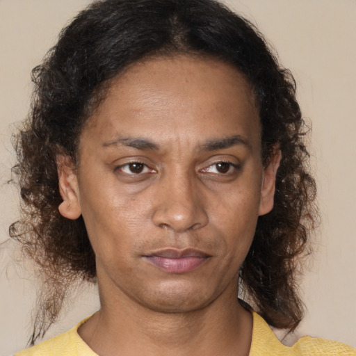 Neutral black adult female with medium  brown hair and brown eyes