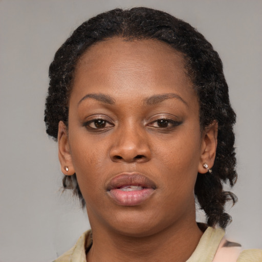 Neutral black adult female with medium  black hair and brown eyes