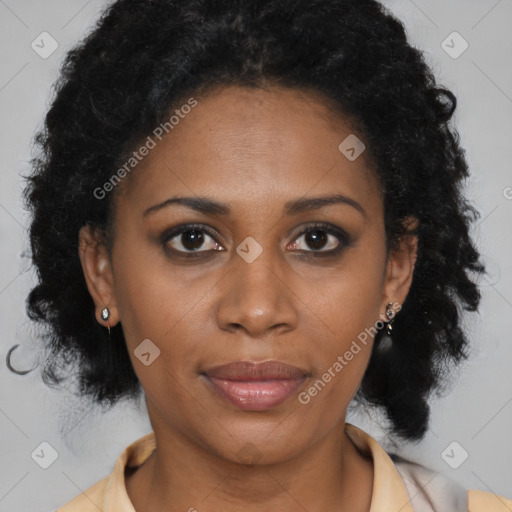 Joyful black young-adult female with medium  brown hair and brown eyes