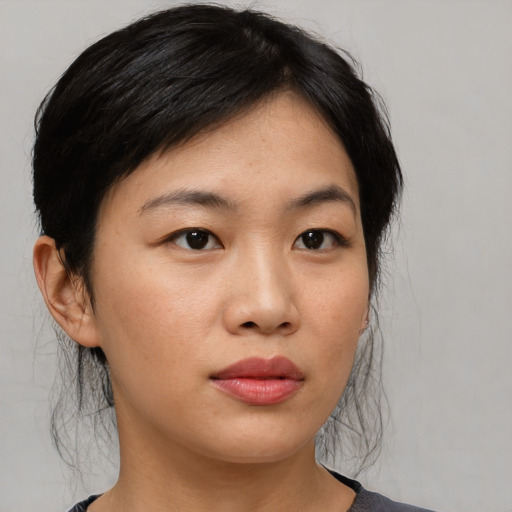 Neutral asian young-adult female with medium  black hair and brown eyes