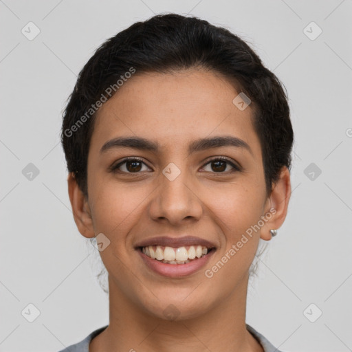 Joyful latino young-adult female with short  brown hair and brown eyes