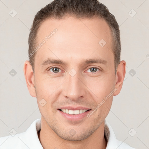 Joyful white young-adult male with short  brown hair and brown eyes