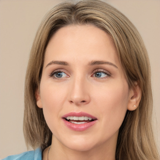 Joyful white young-adult female with long  brown hair and green eyes