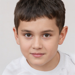 Joyful white child male with short  brown hair and brown eyes