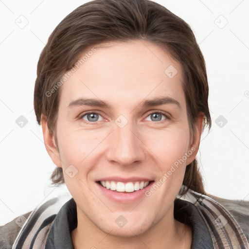 Joyful white young-adult female with medium  brown hair and grey eyes