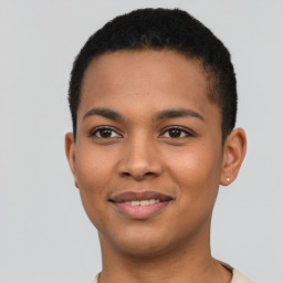 Joyful latino young-adult male with short  brown hair and brown eyes