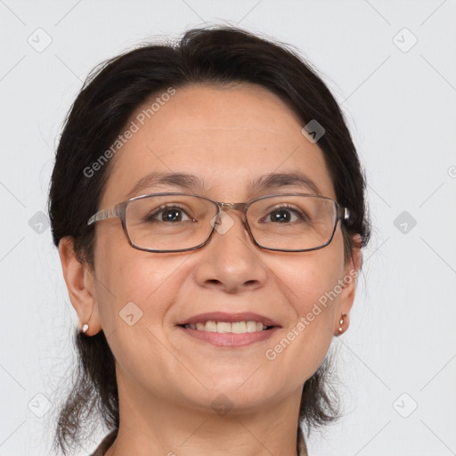 Joyful white adult female with medium  brown hair and brown eyes