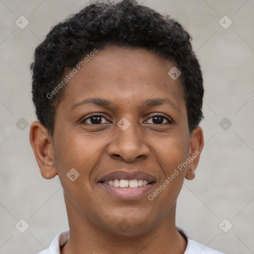 Joyful black young-adult male with short  brown hair and brown eyes