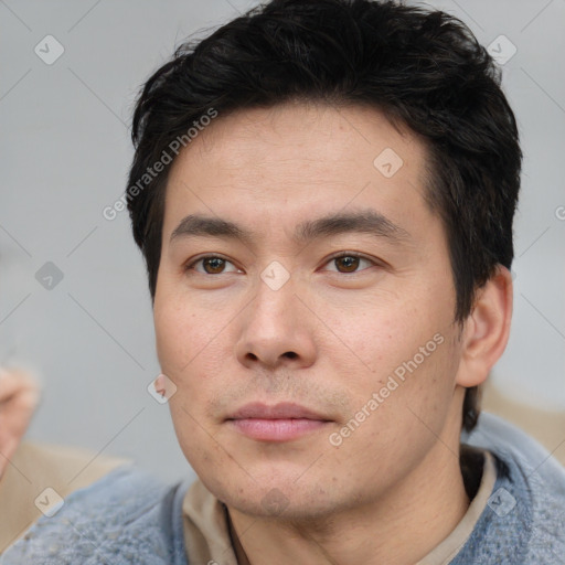 Neutral white young-adult male with short  black hair and brown eyes
