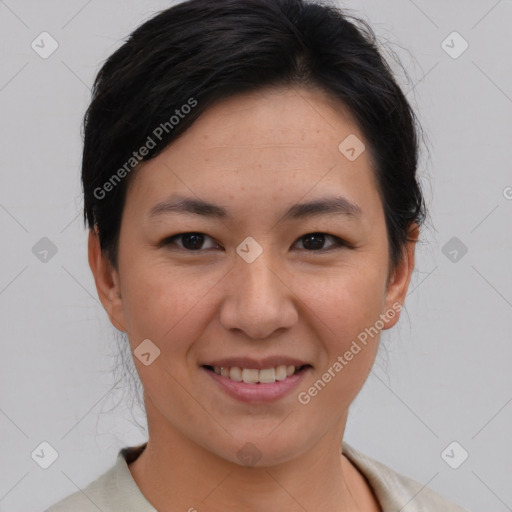 Joyful asian young-adult female with short  brown hair and brown eyes