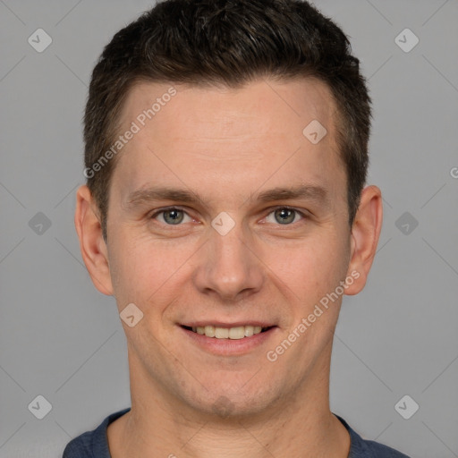 Joyful white adult male with short  brown hair and brown eyes