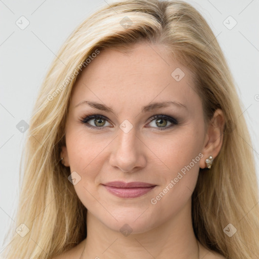 Joyful white young-adult female with long  brown hair and blue eyes