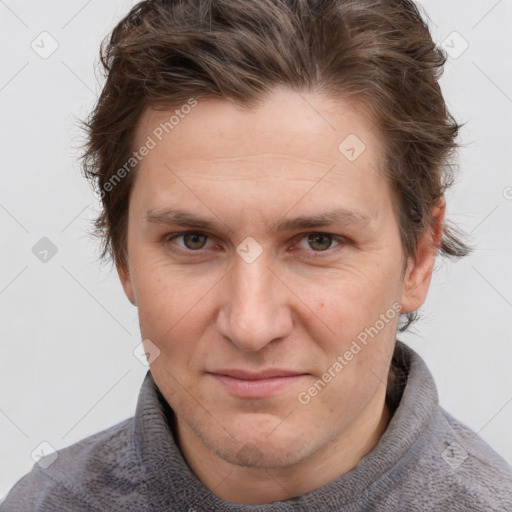 Joyful white adult male with short  brown hair and grey eyes