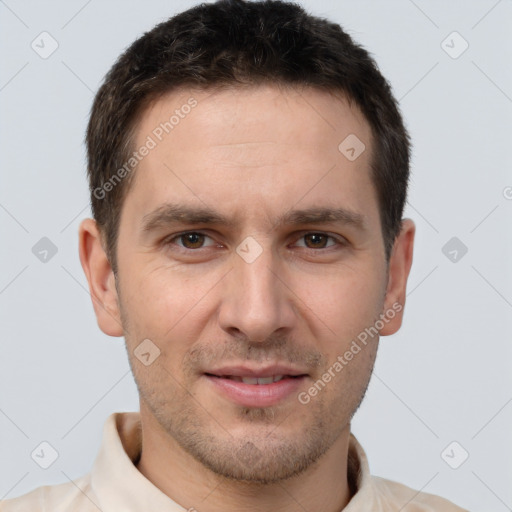 Joyful white young-adult male with short  brown hair and brown eyes