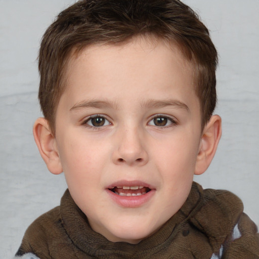 Joyful white child male with short  brown hair and brown eyes