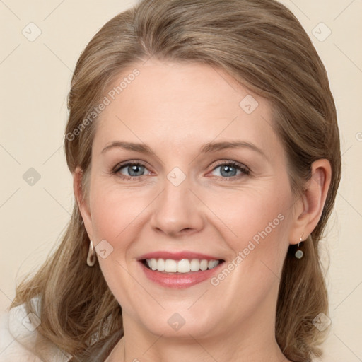 Joyful white young-adult female with long  brown hair and blue eyes