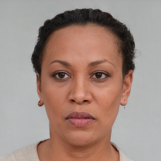Neutral black adult female with short  brown hair and brown eyes