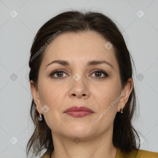 Joyful white adult female with medium  brown hair and brown eyes