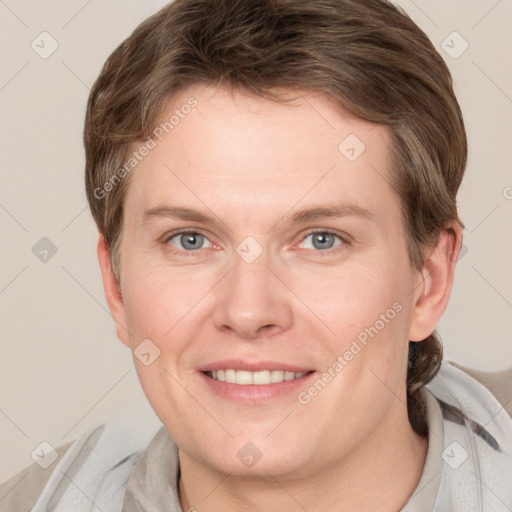 Joyful white adult female with short  brown hair and grey eyes