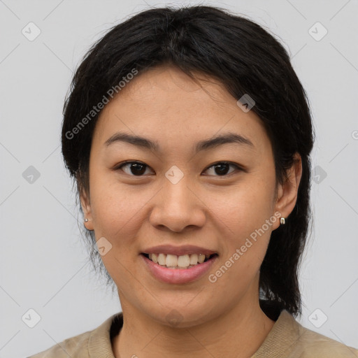 Joyful asian young-adult female with medium  black hair and brown eyes