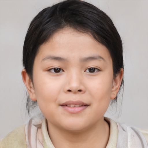 Joyful asian child female with medium  brown hair and brown eyes