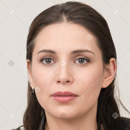 Neutral white young-adult female with long  brown hair and brown eyes