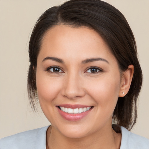 Joyful white young-adult female with medium  brown hair and brown eyes