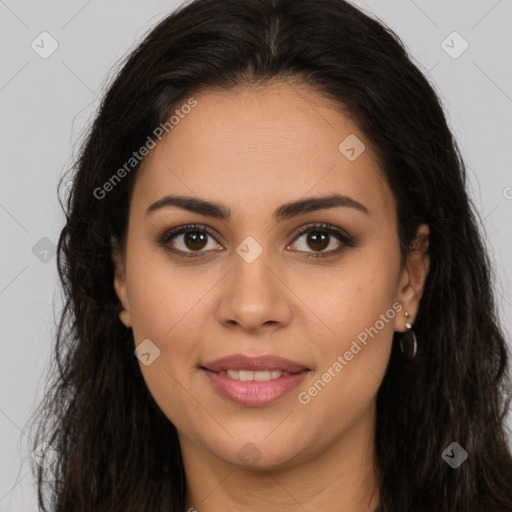 Joyful latino young-adult female with long  brown hair and brown eyes