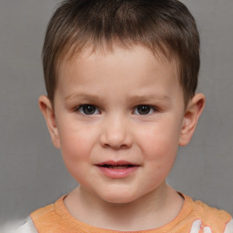 Joyful white child male with short  brown hair and brown eyes