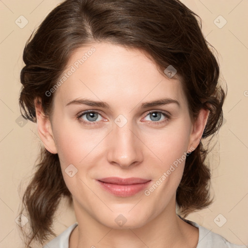 Joyful white young-adult female with medium  brown hair and green eyes