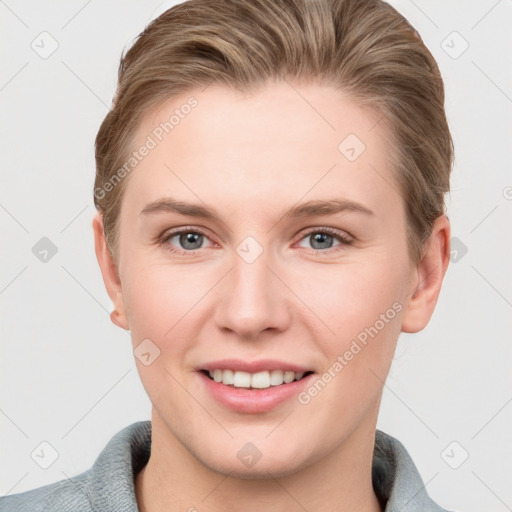 Joyful white young-adult female with short  brown hair and grey eyes