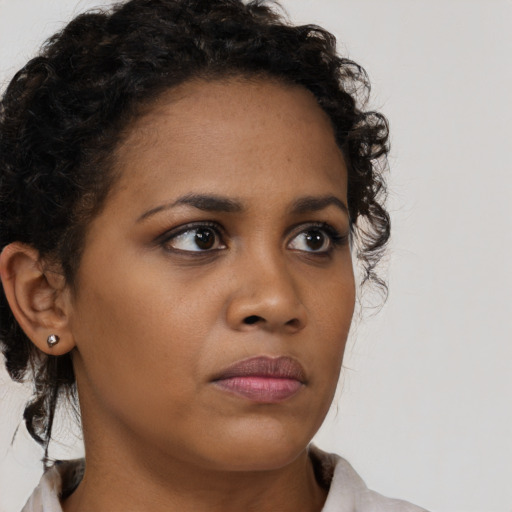 Neutral black young-adult female with short  brown hair and brown eyes