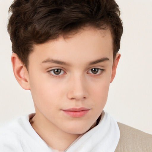 Joyful white child male with short  brown hair and brown eyes