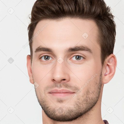 Neutral white young-adult male with short  brown hair and brown eyes