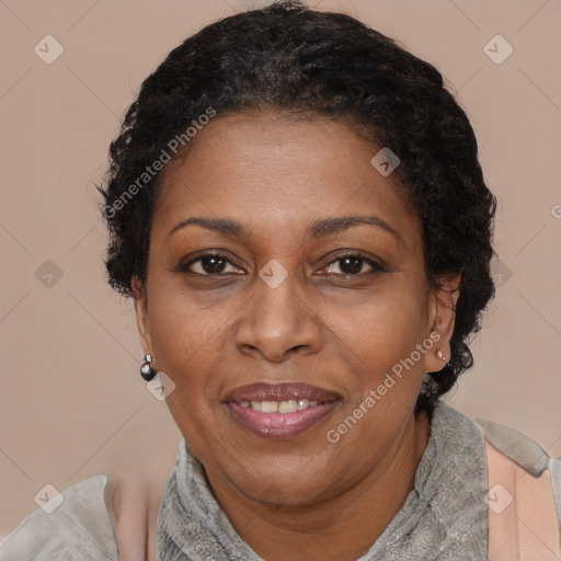 Joyful black adult female with short  brown hair and brown eyes