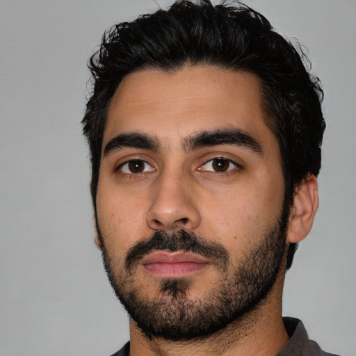 Neutral latino young-adult male with short  black hair and brown eyes