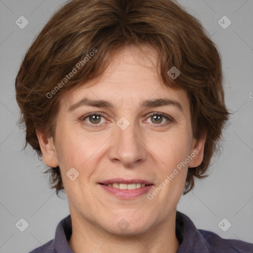 Joyful white adult female with medium  brown hair and grey eyes