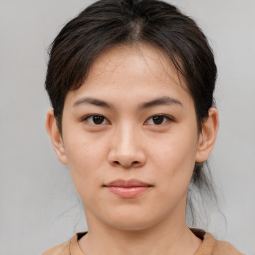 Joyful white young-adult female with medium  brown hair and brown eyes