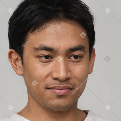 Joyful asian young-adult male with short  black hair and brown eyes