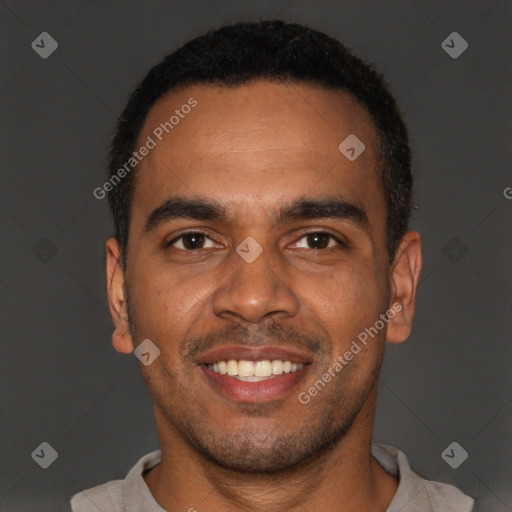 Joyful black young-adult male with short  black hair and brown eyes