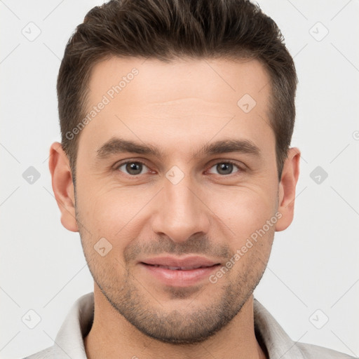 Joyful white young-adult male with short  brown hair and brown eyes