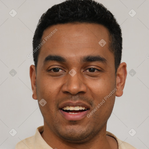 Joyful black young-adult male with short  black hair and brown eyes