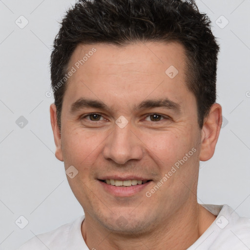 Joyful white adult male with short  brown hair and brown eyes