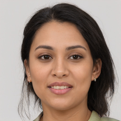 Joyful asian young-adult female with medium  brown hair and brown eyes