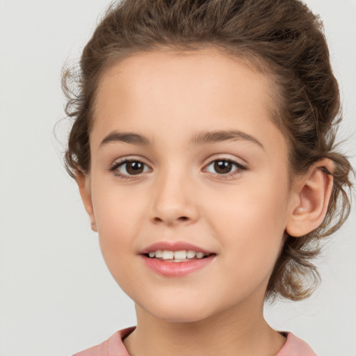 Joyful white child female with medium  brown hair and brown eyes