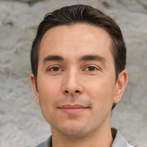 Joyful white young-adult male with short  brown hair and brown eyes